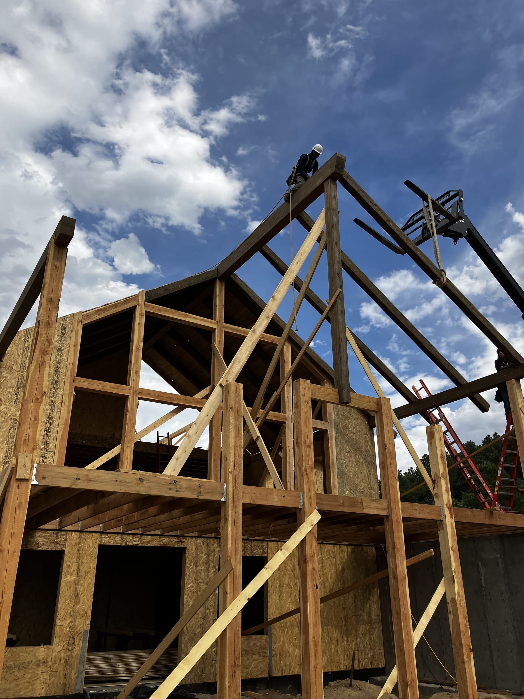 Framed gable wall against a blue sky