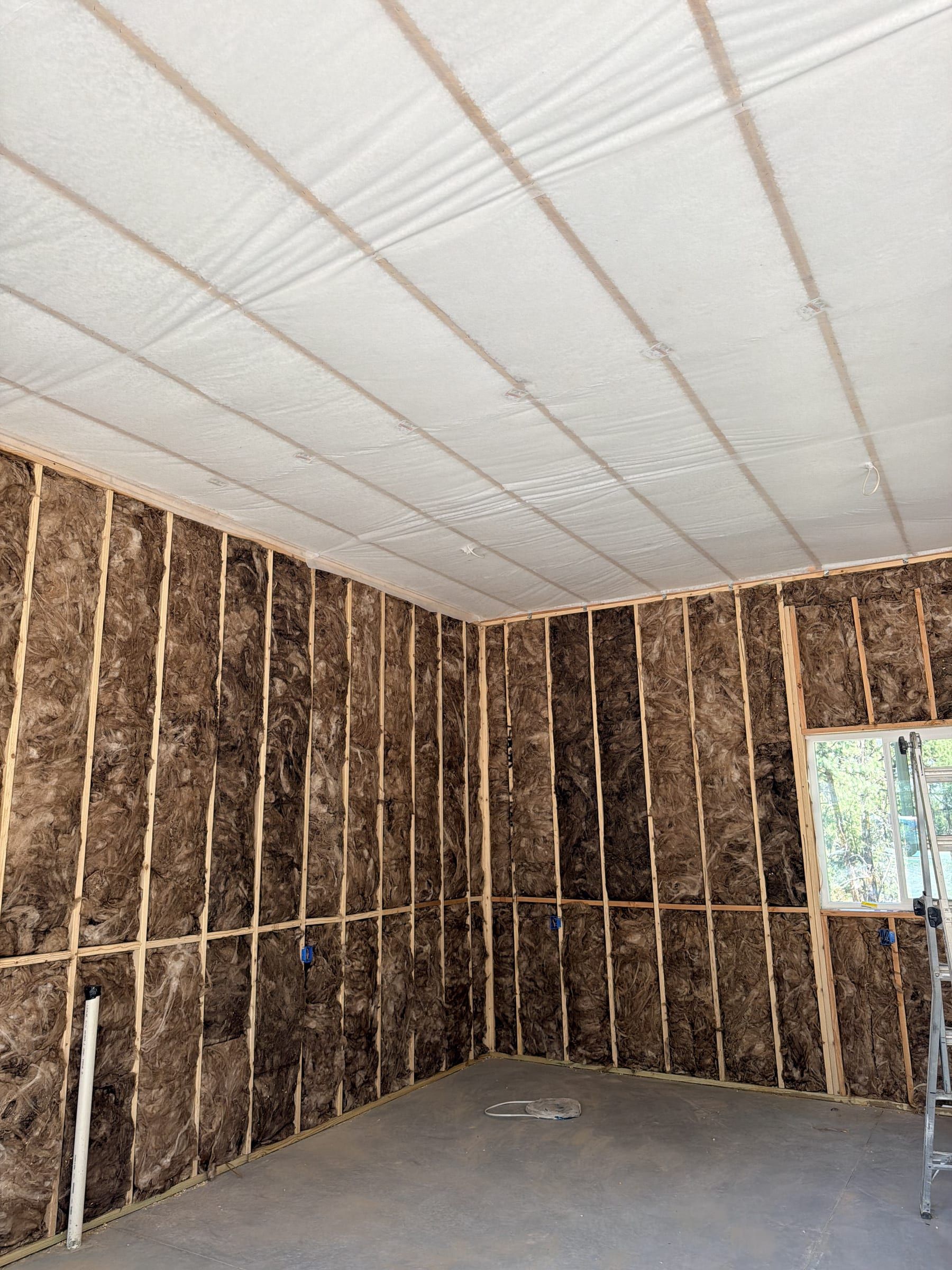 Insulated stud walls before drywall